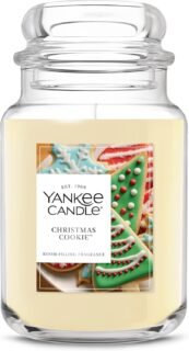 A Yankee Candle jar labeled "CHRISTMAS COOKIE™" featuring festive decorated cookies on the label, with creamy off-white wax inside. 📝 Caption Yankee Candle's "Christmas Cookie™" — a sweet, festive fragrance that captures the cozy warmth of holiday baking. 📋 Description This image showcases a Yankee Candle from the "Christmas Cookie™" collection, part of the brand's seasonal lineup. The jar features a nostalgic label with colorful Christmas cookies, including a tree-shaped treat adorned with green icing and red candy dots. The candle's creamy off-white wax hints at its rich, bakery-inspired scent — a blend designed to evoke the comforting aroma of freshly baked sugar cookies during the holiday season. Perfect for creating a warm, inviting atmosphere in any room. Would you like help writing a product listing or social media post using this image?